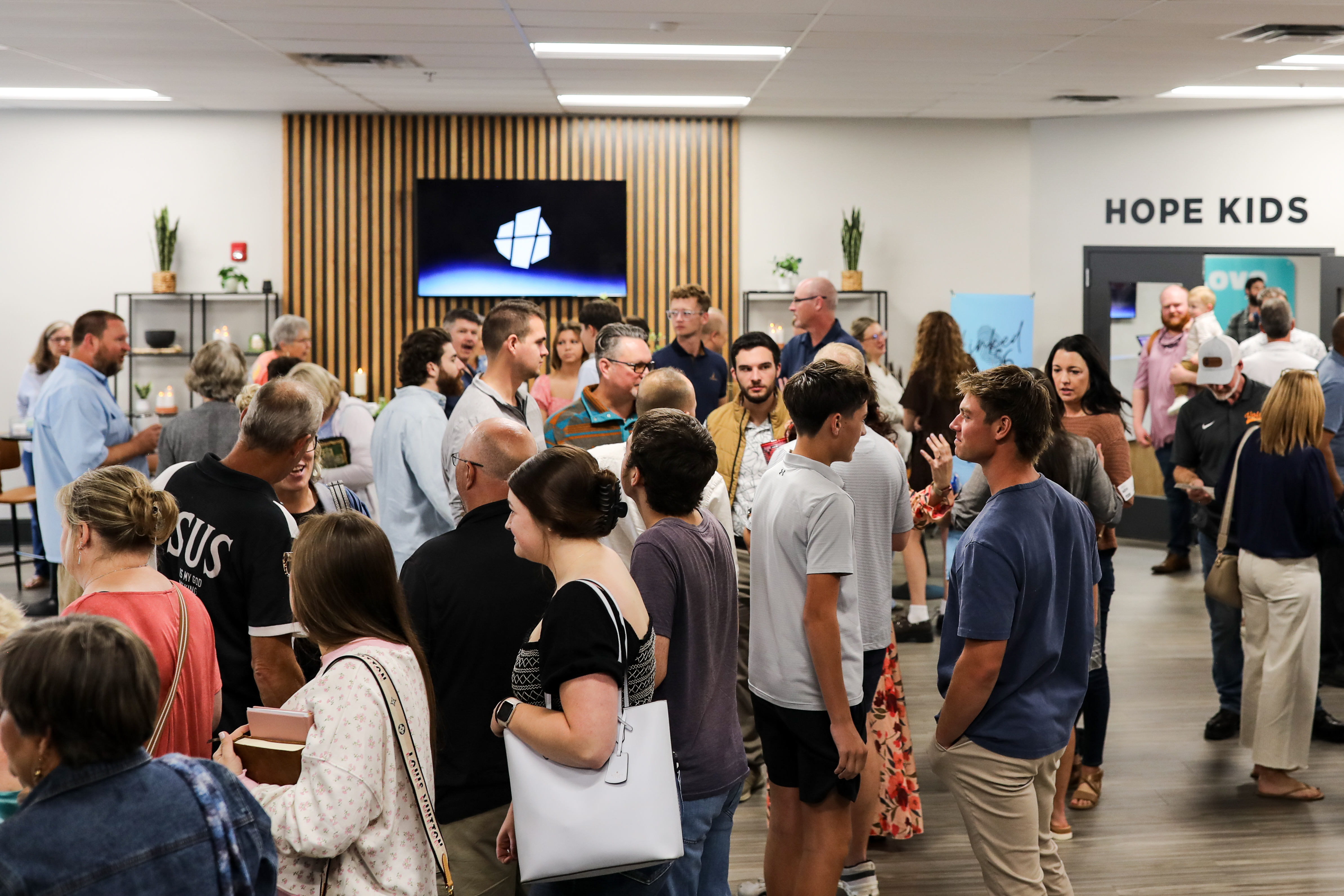 Hope Church family connecting in the lobby after a Sunday service